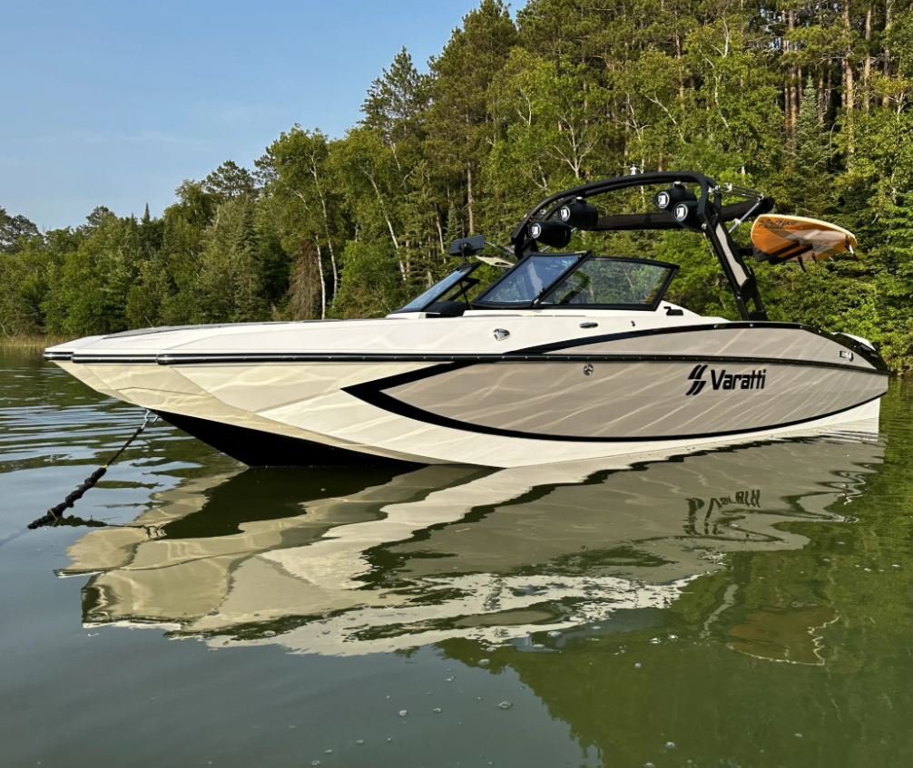Wake boat performing surf turn on lake in BC